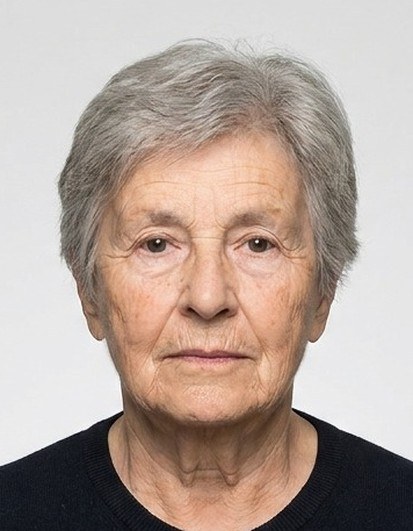 Biometrically cropped ID photo of an older woman with grey hair.