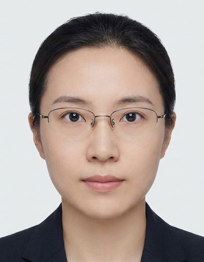 Biometrically cropped ID photo of a woman wearing glasses.